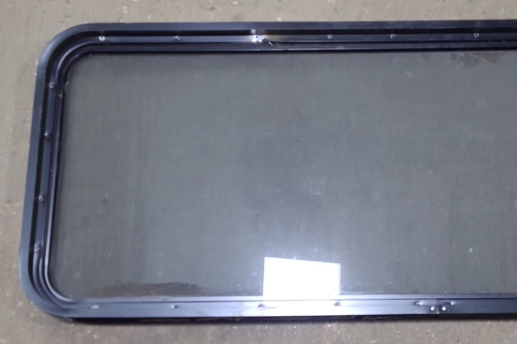 Used Black Radius Non Opening Window : 60 1/4" W x 21 3/4" H x 1 3/4" D - Young Farts RV Parts