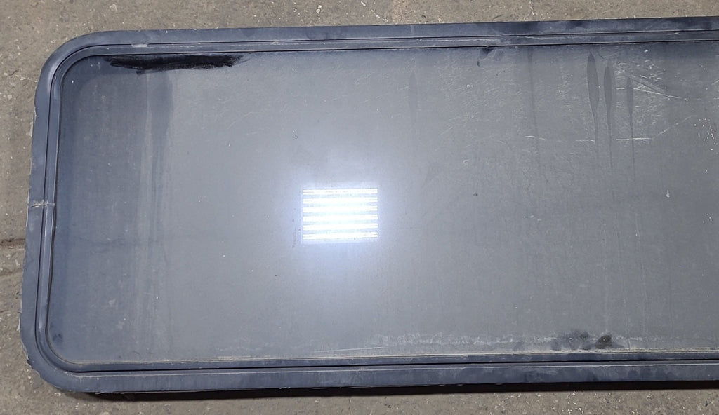 Used Black Radius Non Opening Window : 60 1/4" W x 21 3/4" H x 1 3/4" D - Young Farts RV Parts