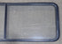 Used Black Radius Non-Opening Window : 60 1/4" W X 21 3/8" H X 1 7/8" D - Young Farts RV Parts