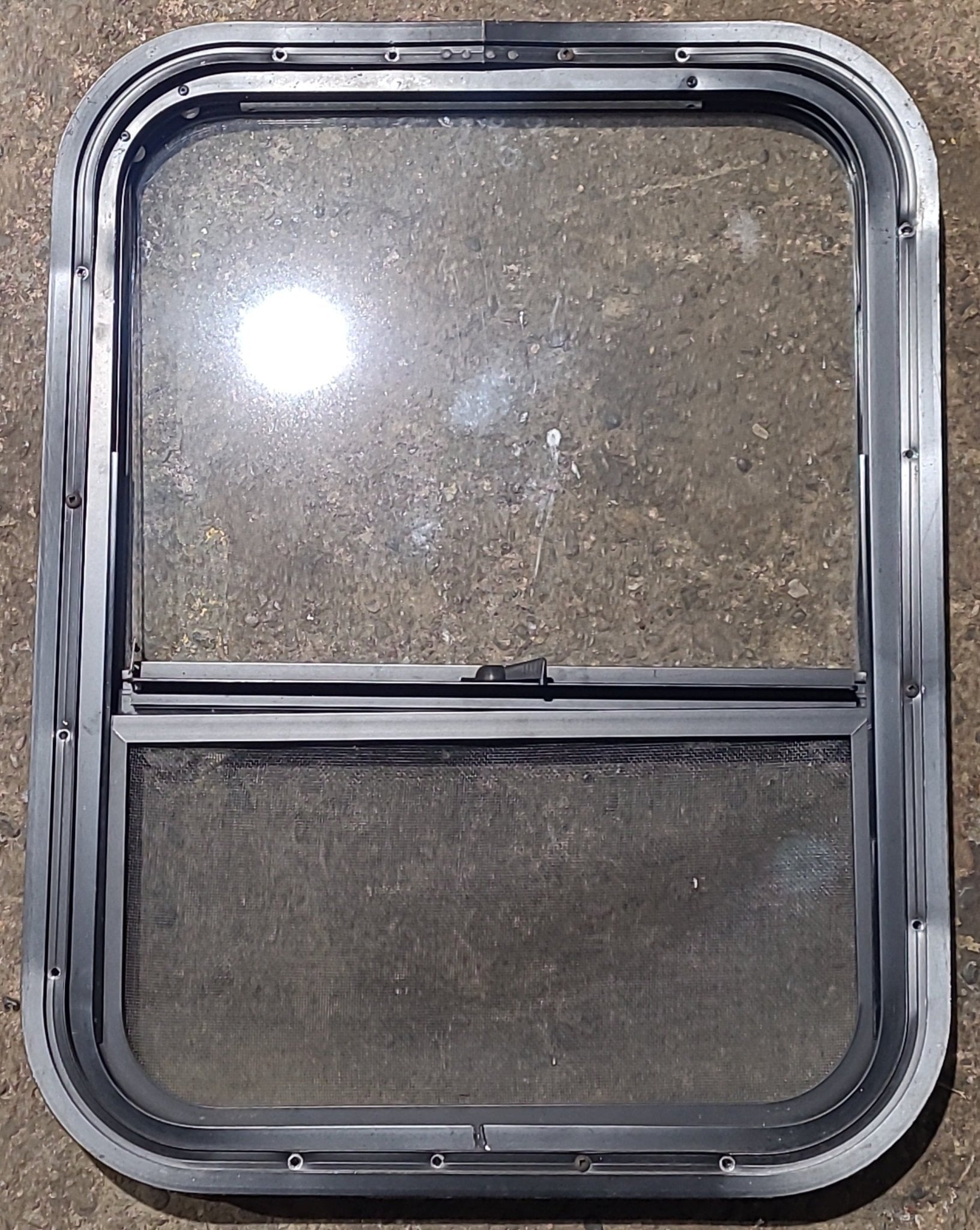 Used Black Radius Opening Window : 17 1/2" W x 23 1/2" H x 1 3/8" D - Young Farts RV Parts