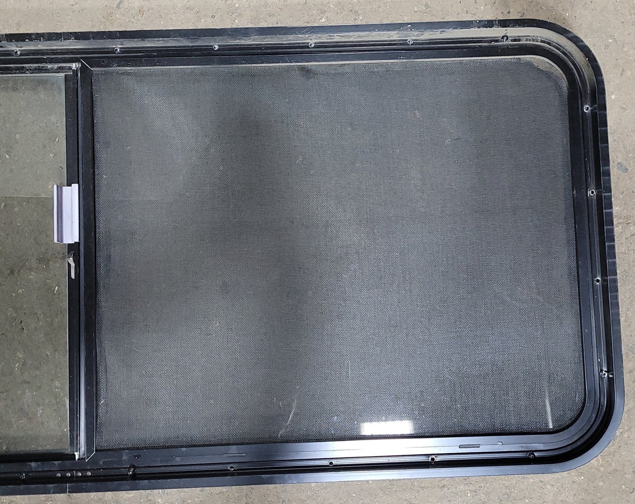 Used Black Radius Opening Window : 22" X 54 1/2" X 2" D - Young Farts RV Parts