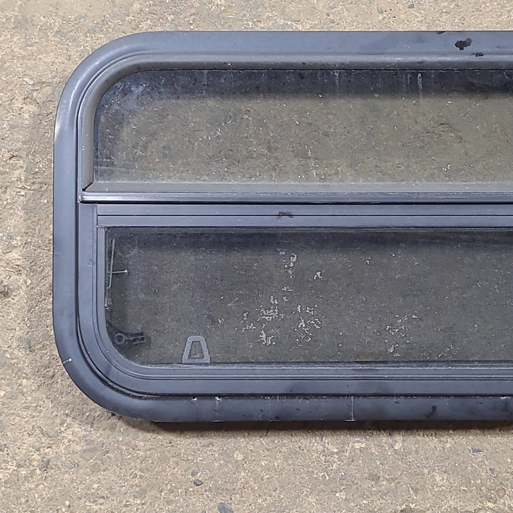 Used Black Radius Opening Window : 23 1/2" W x 14 1/2" H x 1 3/4" D - Young Farts RV Parts