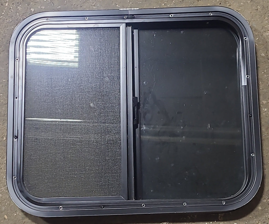 Used Black Radius Opening Window : 23 1/2" W x 19 1/2" H x 1 5/8" D - Young Farts RV Parts