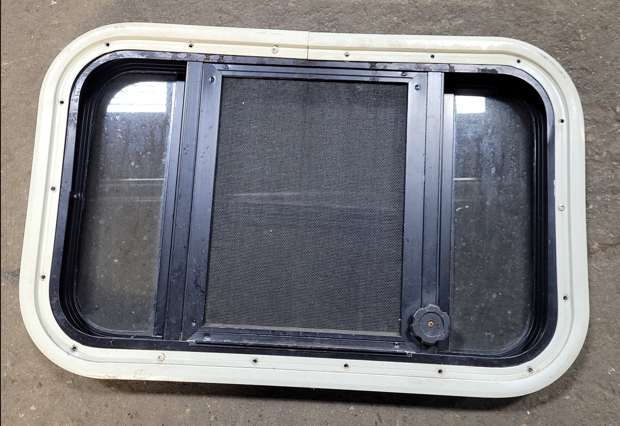 Used Black Radius Opening Window : 23" X 14 1/4" X 1 3/4" D - Young Farts RV Parts