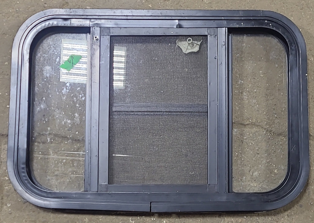 Used Black Radius Opening Window : 24 3/4" W x 16 1/2" H x 1 5/8" D - Young Farts RV Parts