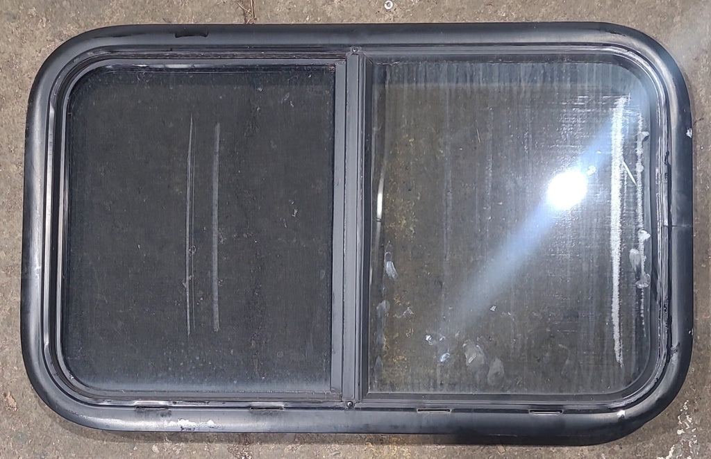 Used Black Radius Opening Window : 29 1/2" W x 17 1/2" H x 1 3/4" D - Young Farts RV Parts