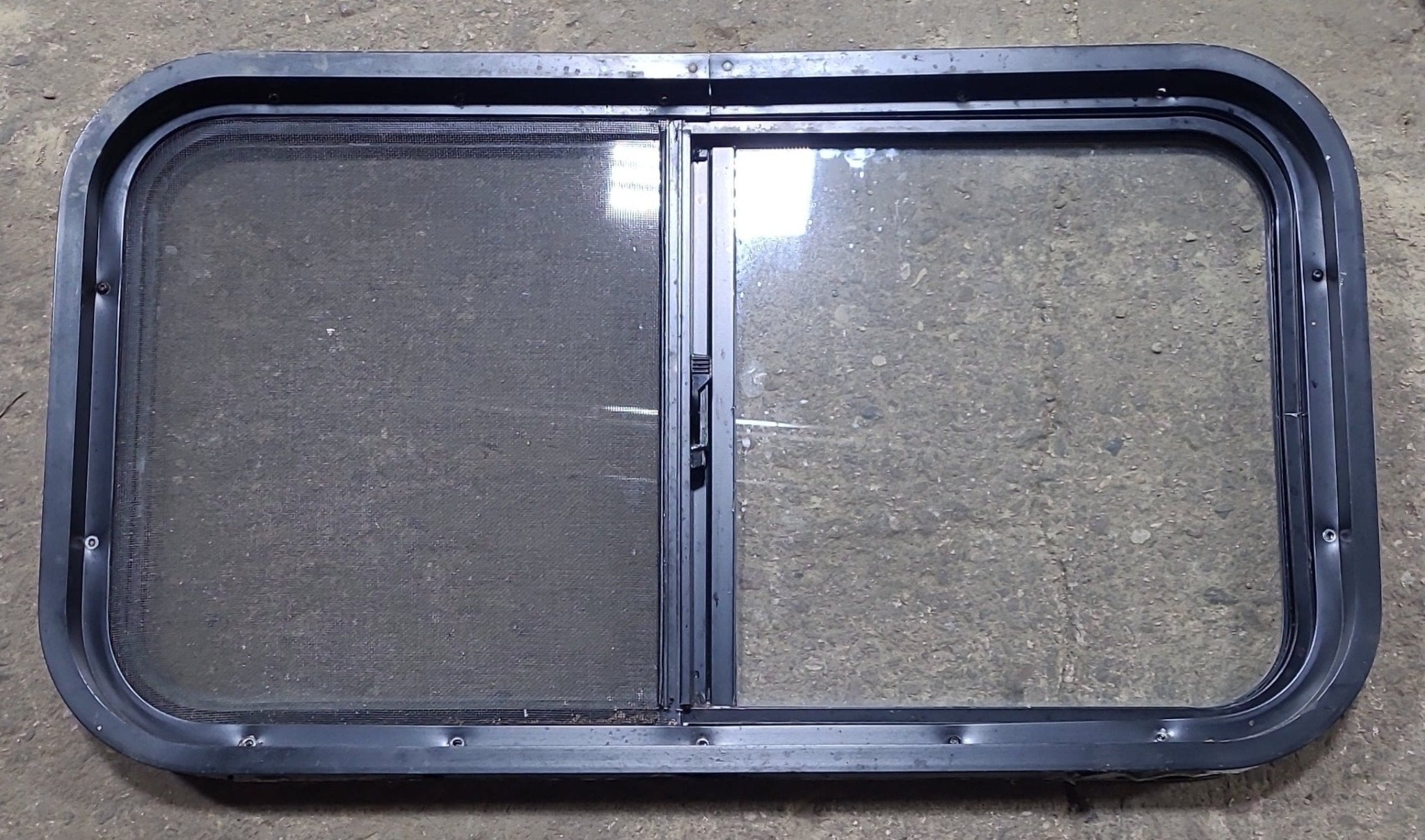 Used Black Radius Opening Window : 30 1/4" W x 16 1/4" H x 2" D - Young Farts RV Parts