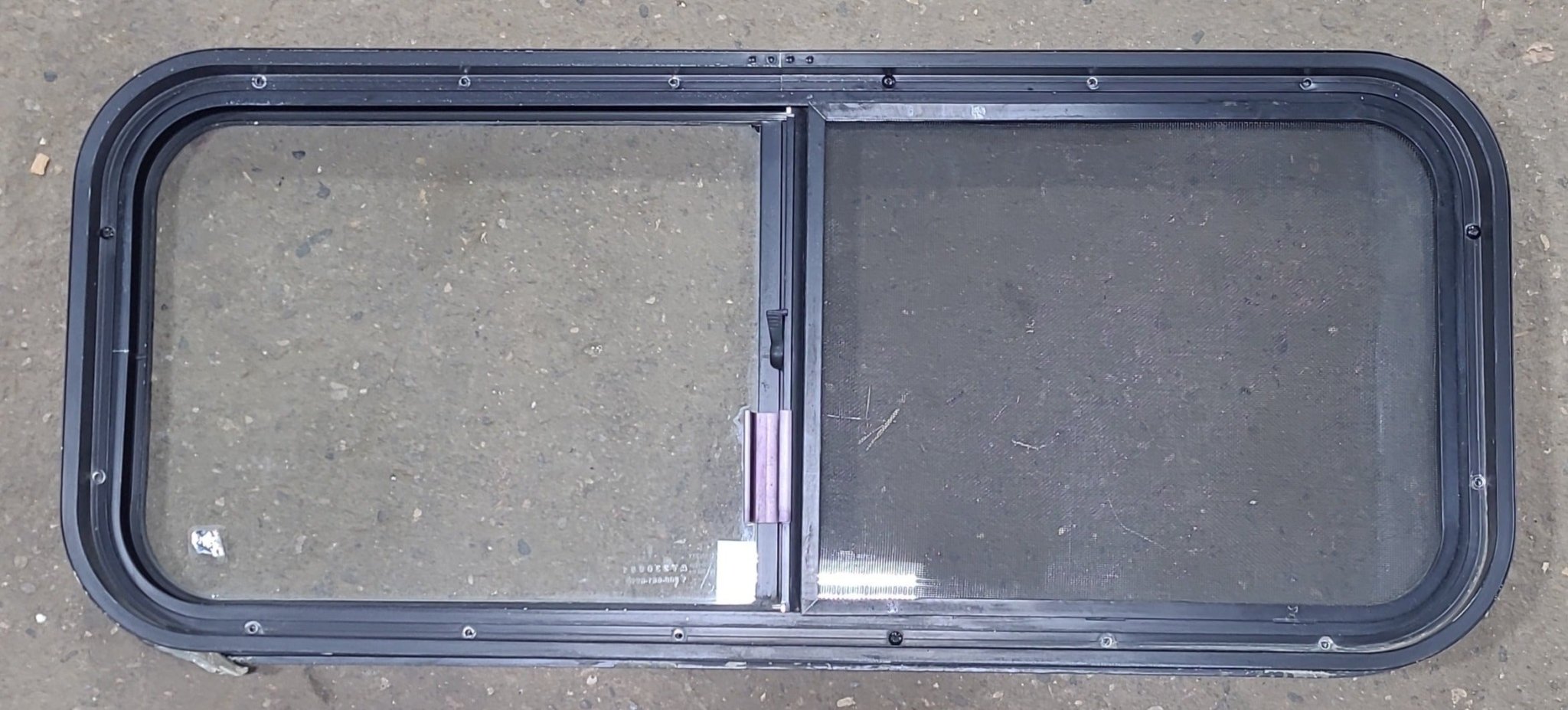 Used Black Radius Opening Window : 36 1/2" W x 14 3/4" H x 1 3/4" D - Young Farts RV Parts