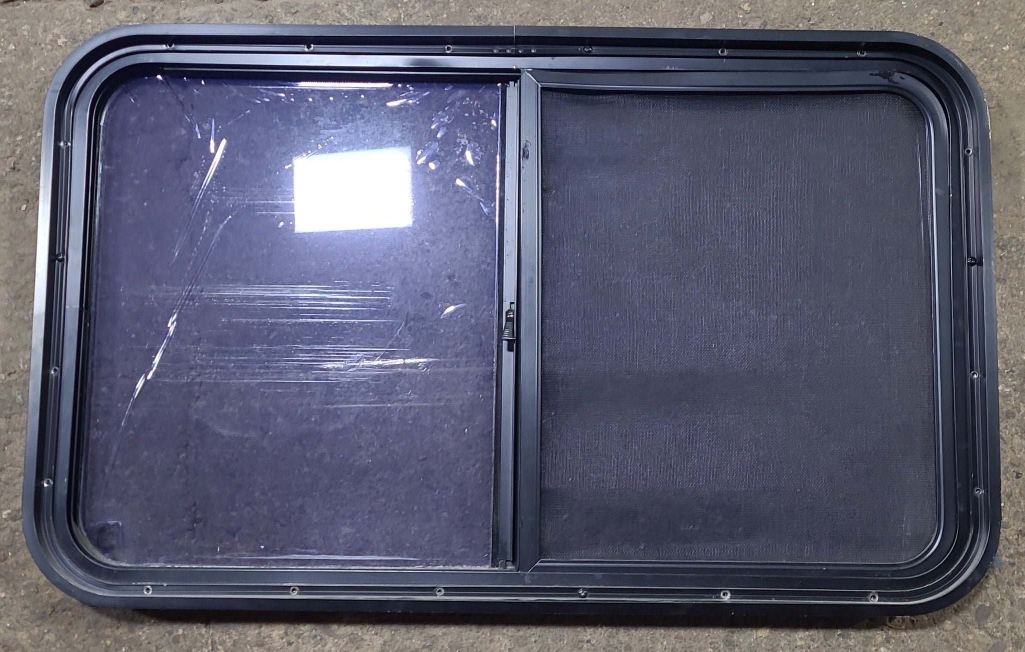 Used Black Radius Opening Window : 36 1/2" W x 21 3/4" H x 1 3/4" D - Young Farts RV Parts