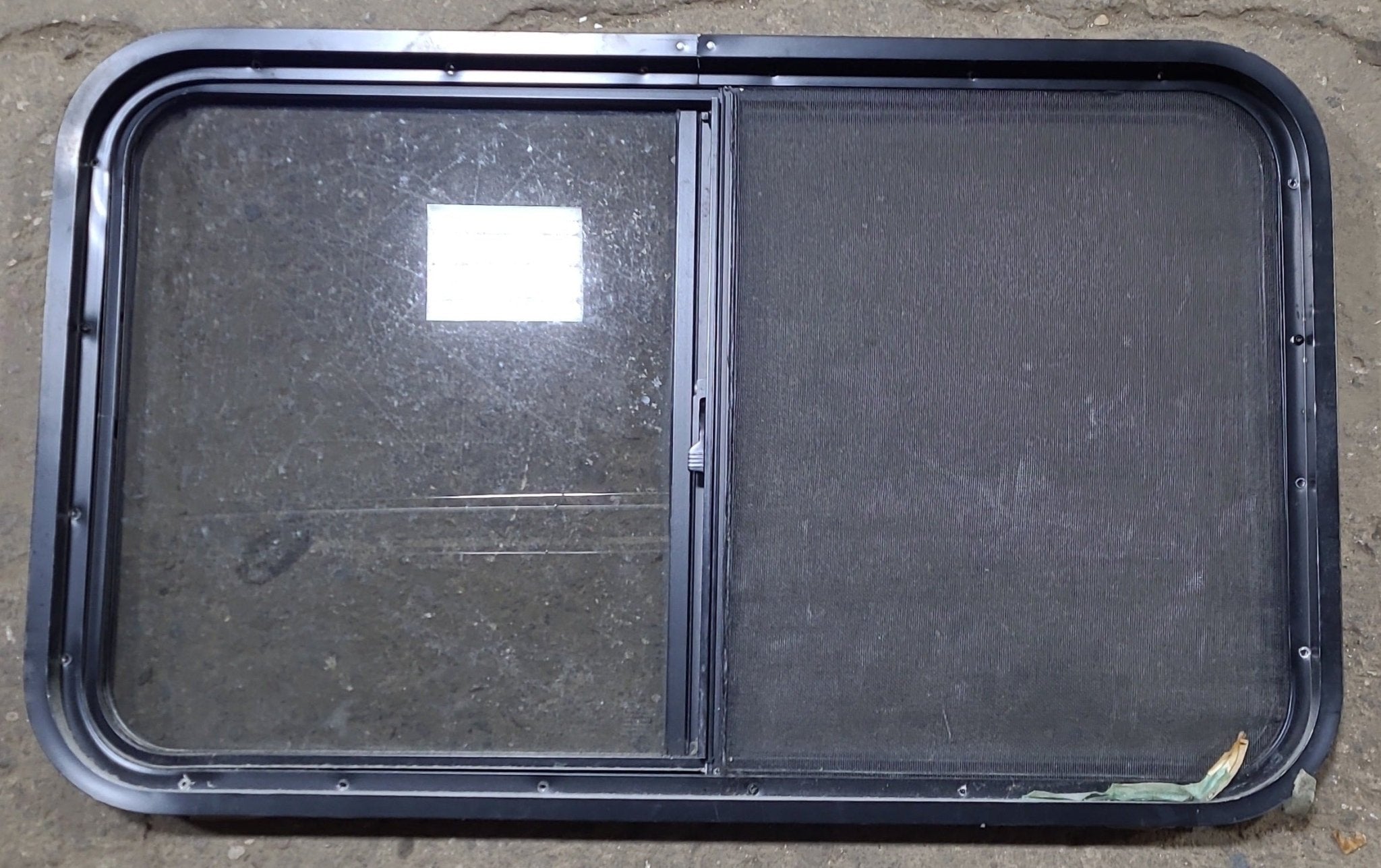 Used Black Radius Opening Window : 36 1/2" W x 21 3/4" H x 1 3/4" D - Young Farts RV Parts