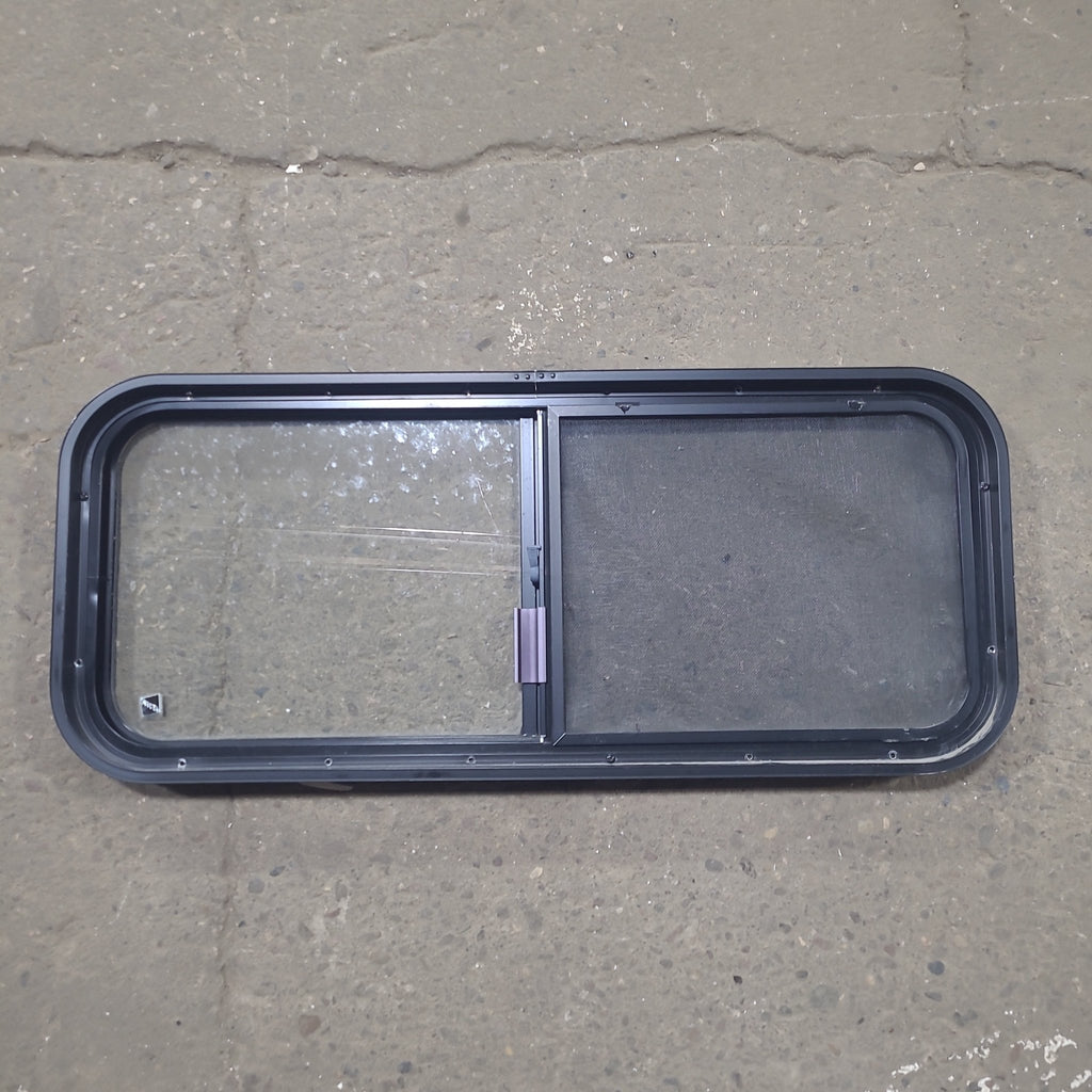 Used Black Radius Opening Window : 36 1/4" W x 14 3/4" H x 1 3/4" D - Young Farts RV Parts