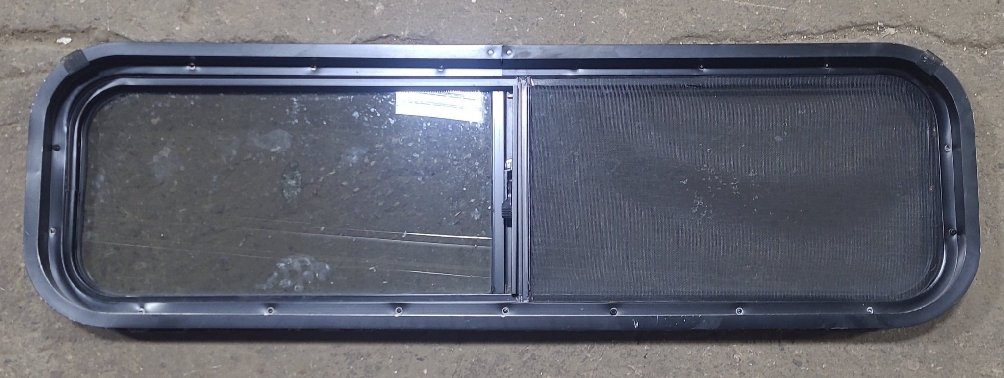 Used Black Radius Opening Window : 42 1/4" W x 11 3/4" H x 1 7/8" D - Young Farts RV Parts