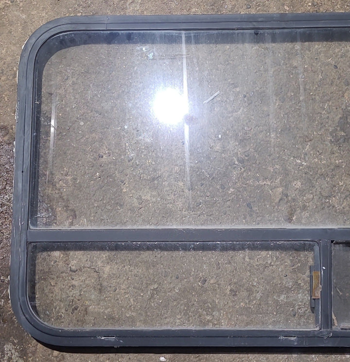 Used Black Radius Opening Window : 47 1/2" W x 25 1/2" H x 1 1/2" D - Young Farts RV Parts