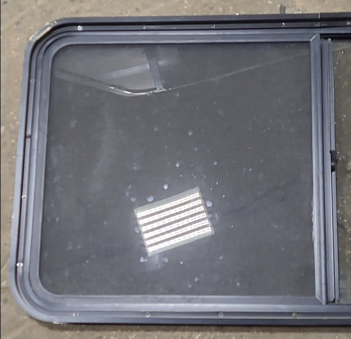 Used Black Radius Opening Window : 47 3/4" W x 23 3/4" H x 1 7/8" D - Young Farts RV Parts