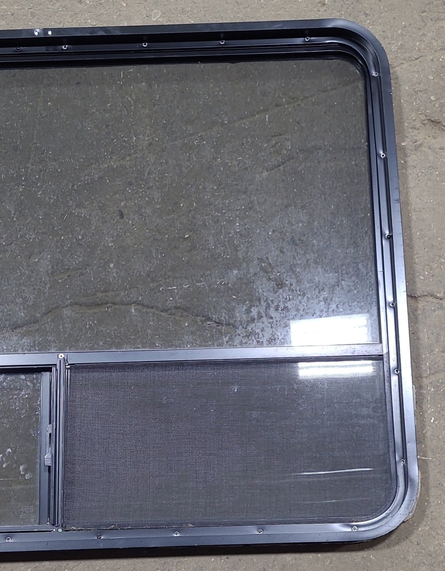 Used Black Radius Opening Window : 48 1/4" W x 35 3/4" H x 1 3/4" D - Young Farts RV Parts