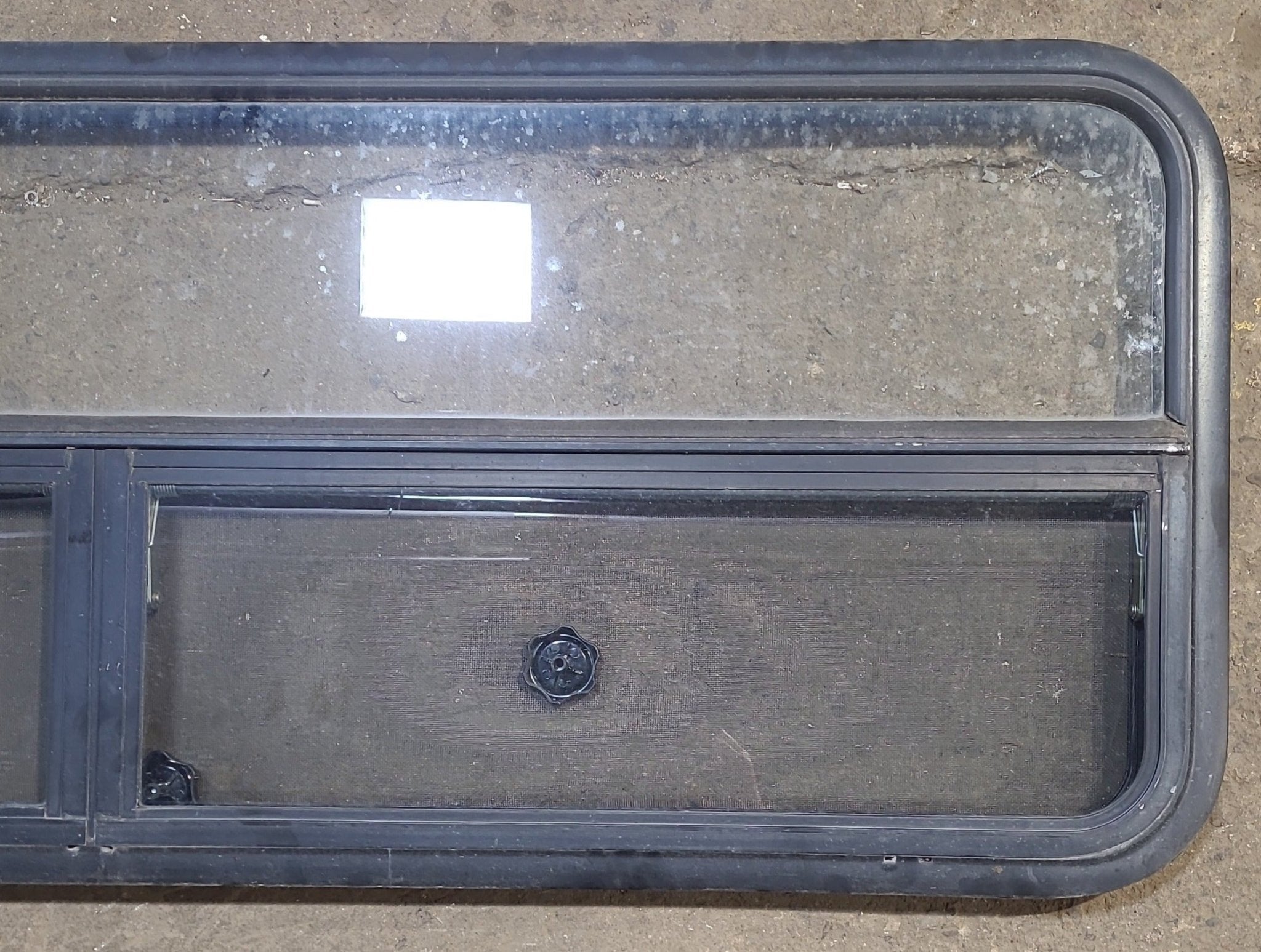 Used Black Radius Opening Window : 59 1/4" W x 21 1/4" H x 1 7/8" D - Young Farts RV Parts