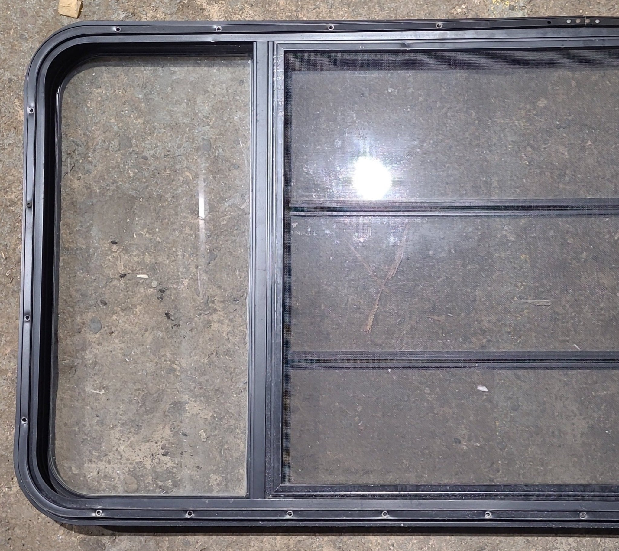 Used Black Radius Opening Window : 59 3/4" W x 26" H x 1 1/4" D - Young Farts RV Parts