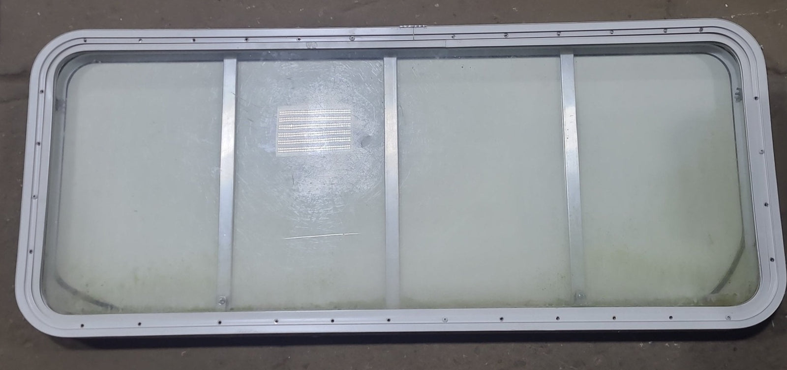 Used Radius Opening Rock Guard Covered Window : 53 1/4