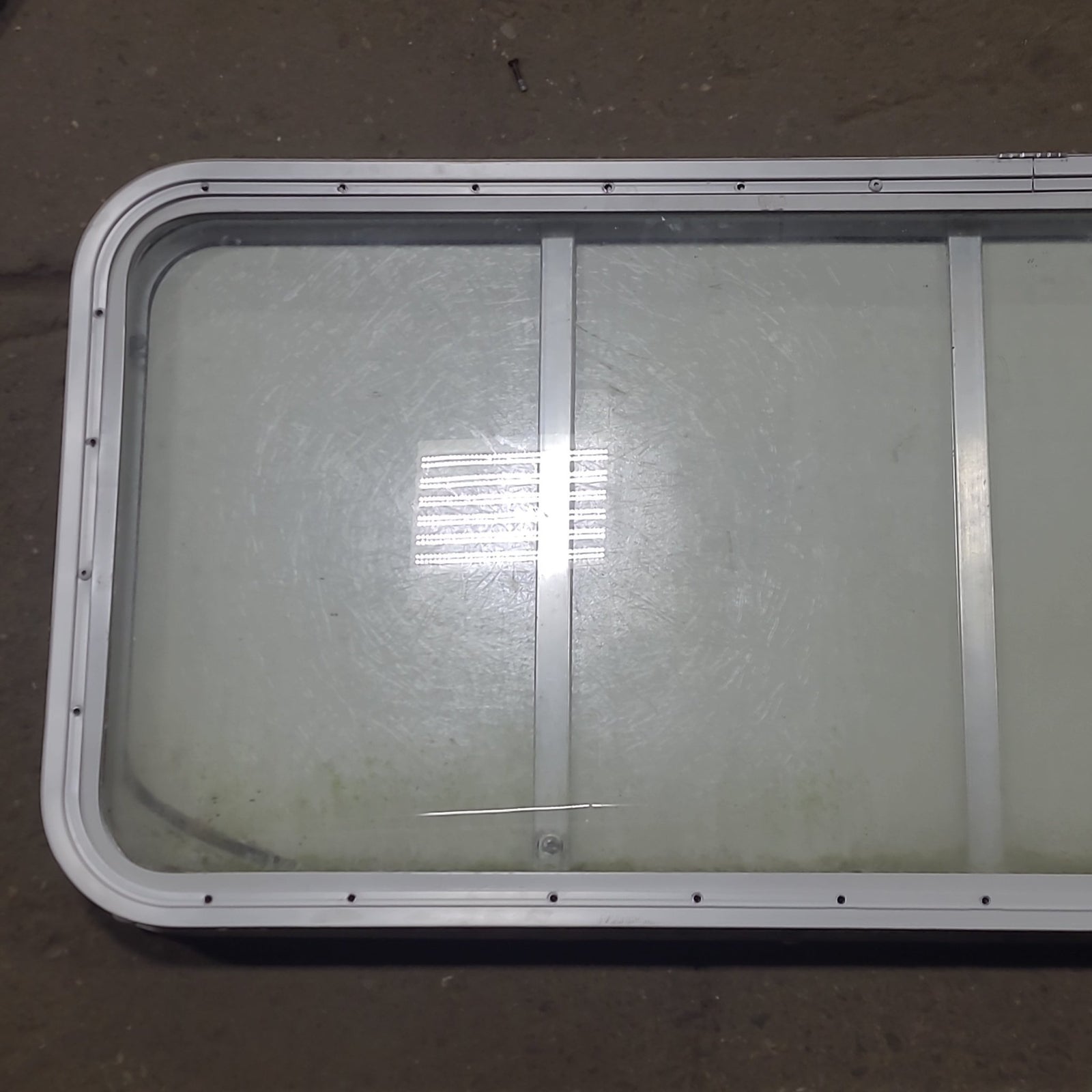Used Radius Opening Rock Guard Covered Window : 53 1/4