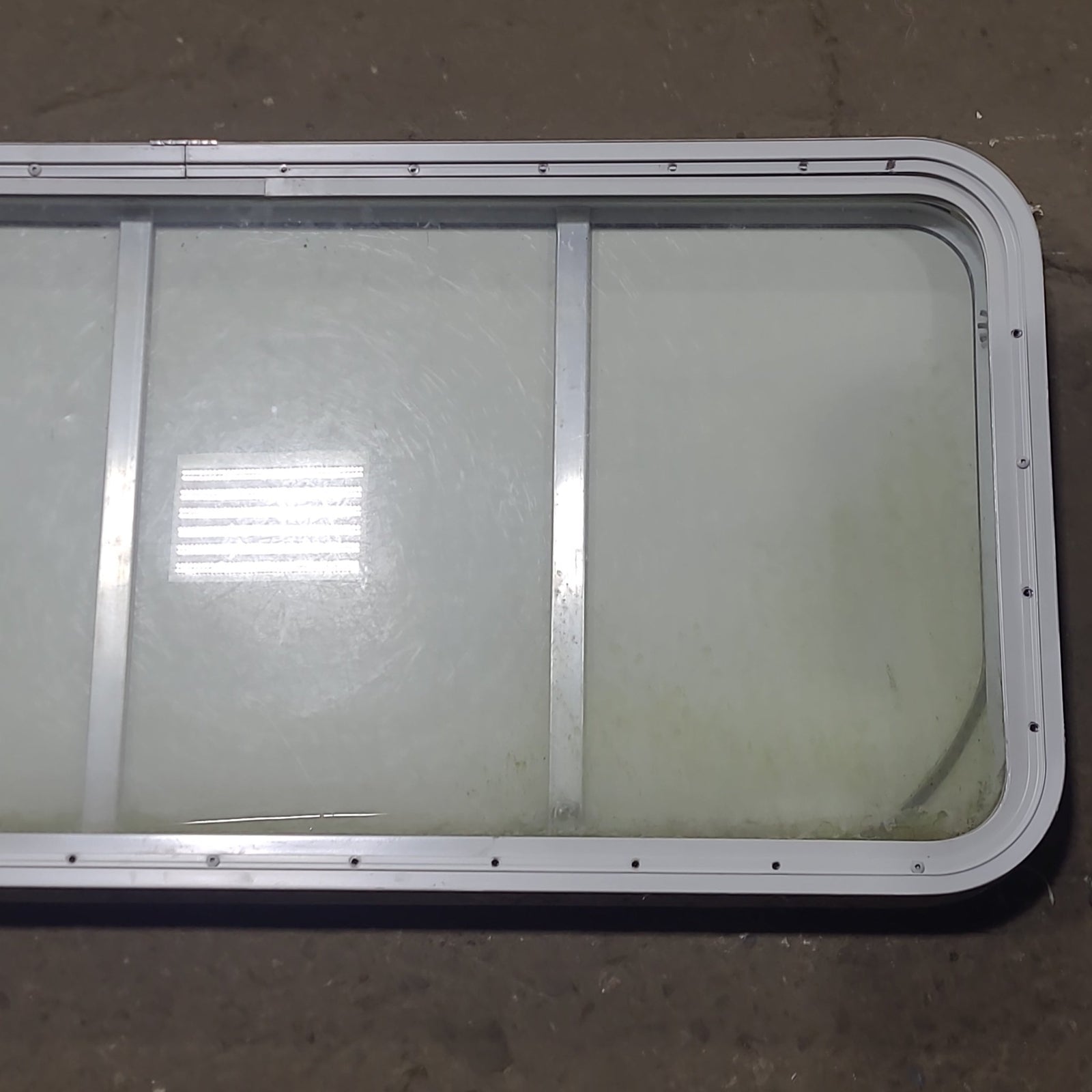 Used Radius Opening Rock Guard Covered Window : 53 1/4