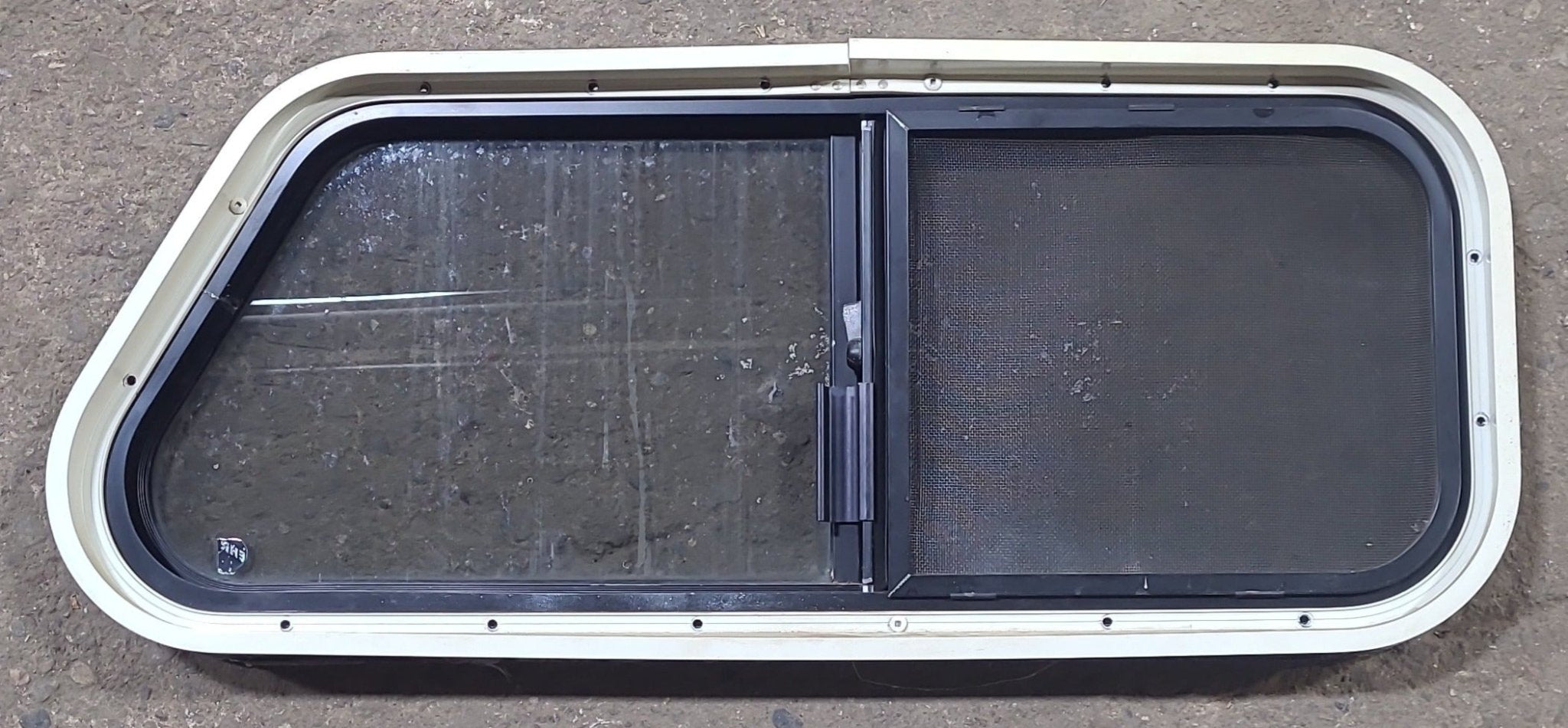 Used Slanted Black Radius Opening Window : 30 1/4" W X 11 3/4" H X 1 7/8" D - Young Farts RV Parts