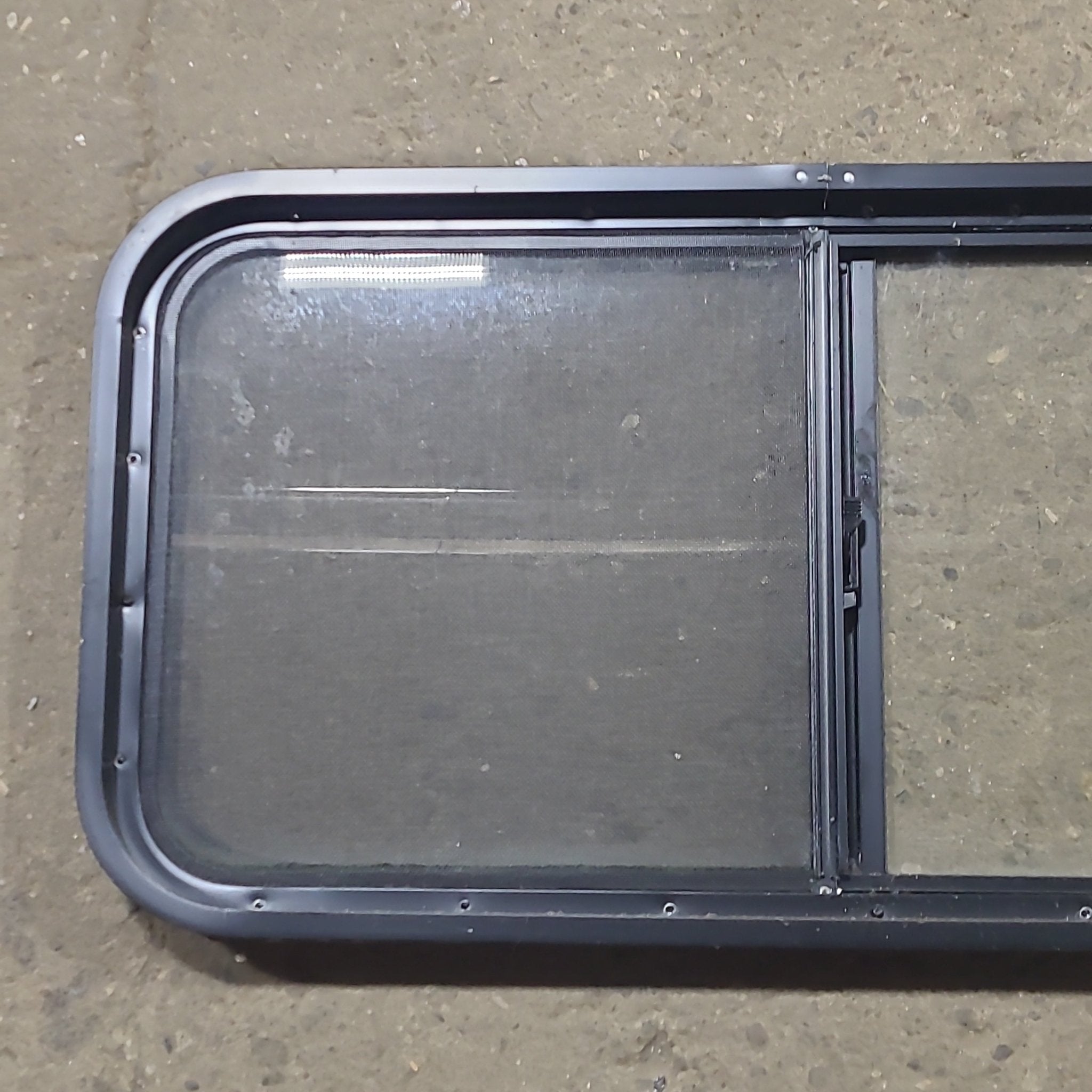 Used Slanted Black Radius Opening Window : 41 3/4" W x 17 3/4" H x 1 7/8" D - Young Farts RV Parts