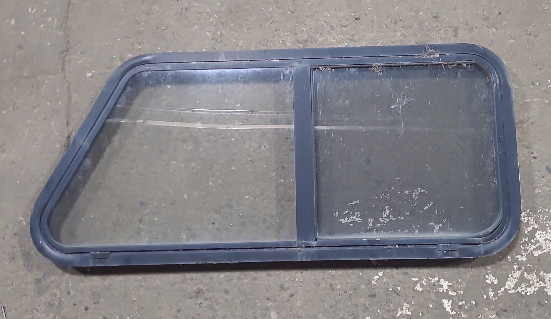 Used Slanted Black Radius Opening Window : 41 3/4" W x 17 3/4" H x 1 7/8" D - Young Farts RV Parts